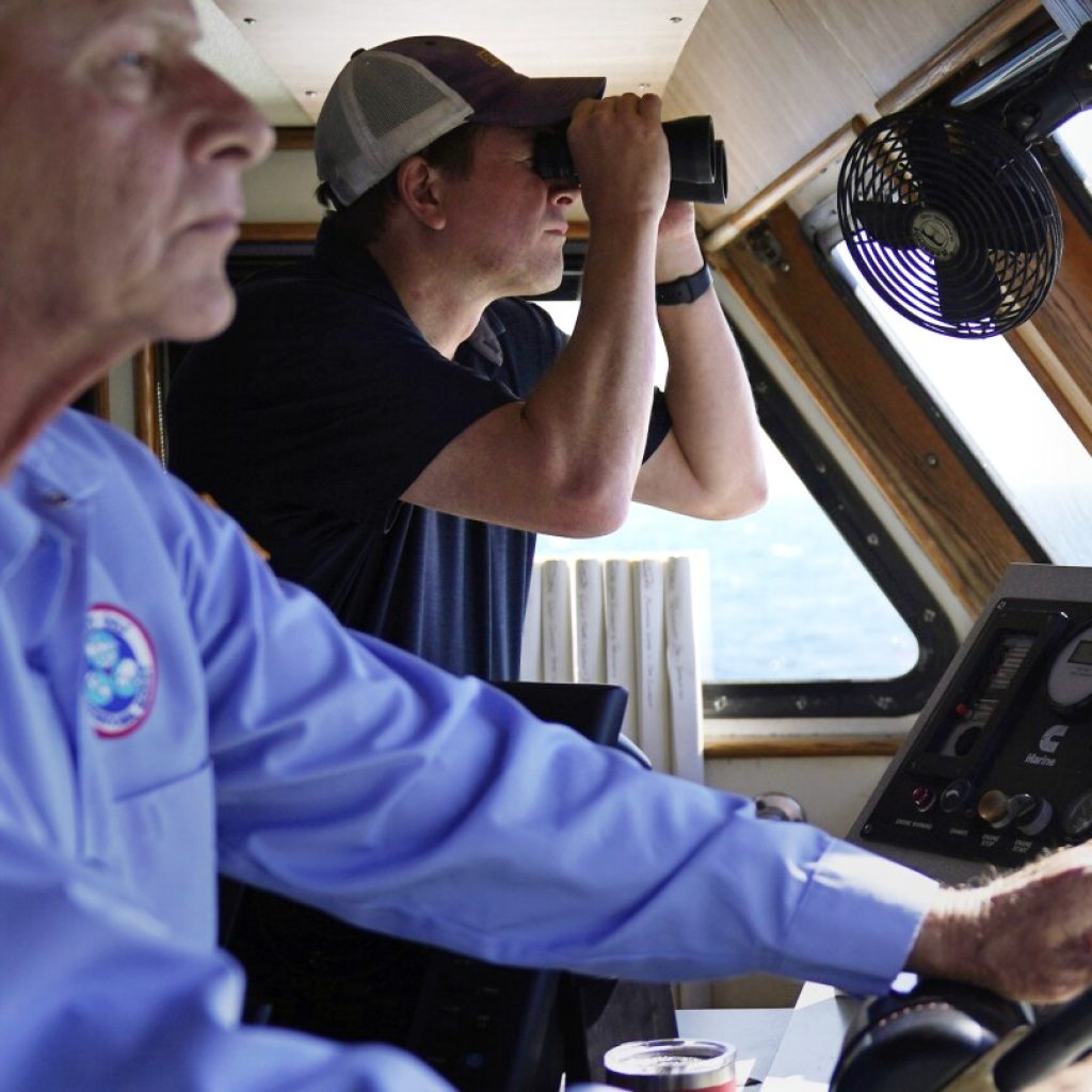 American boat patrols waters around new offshore wind farms to protect jobs | AP News