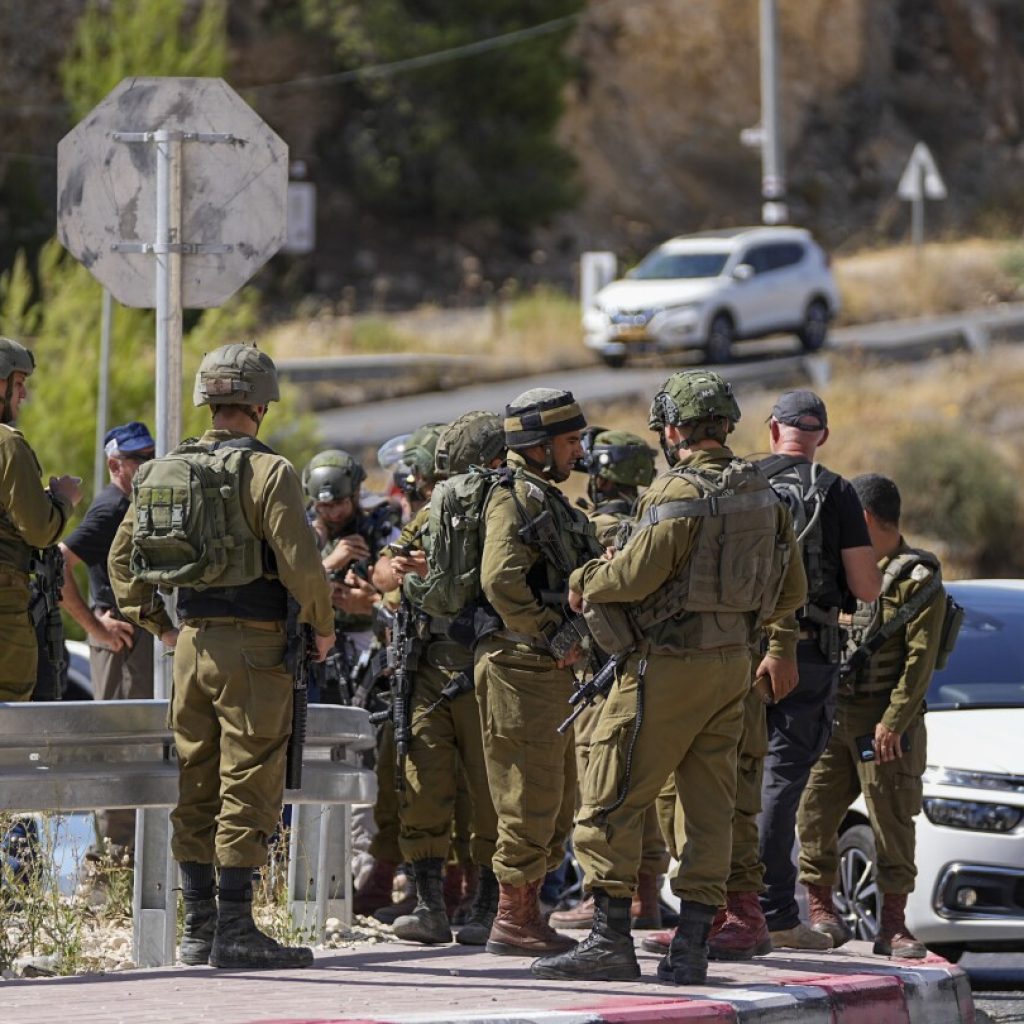 Palestinian gunman opens fire on a car in the occupied West Bank wounding 3, including 2 girls | AP News