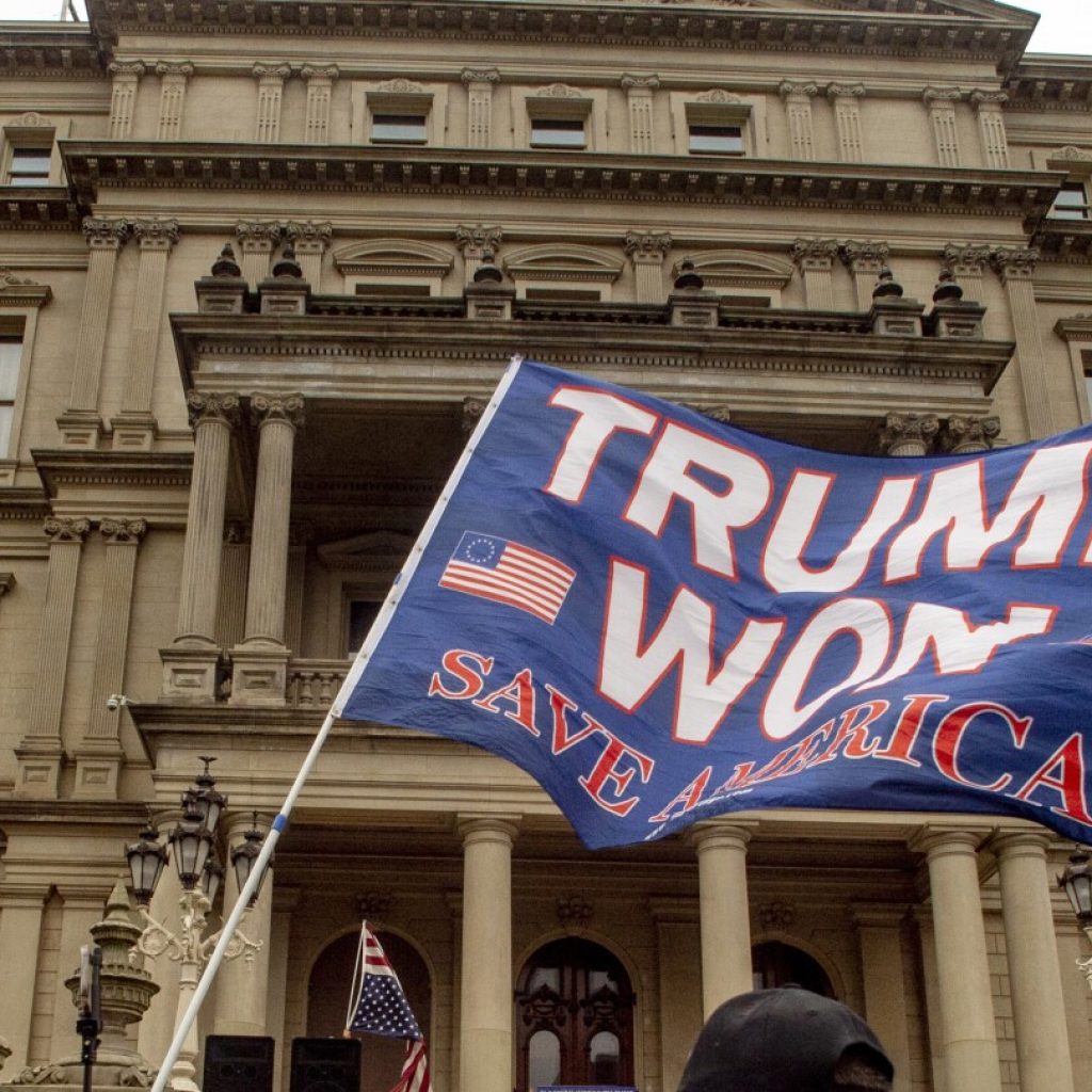 Michigan charges 16 fake electors for Donald Trump with election law and forgery felonies | AP News