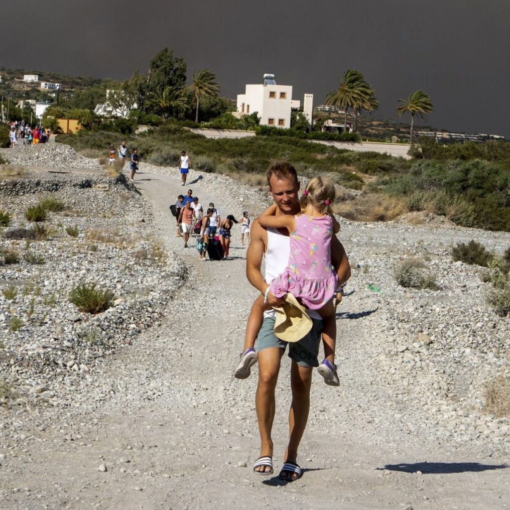 Greek authorities evacuate some 19,000 people as wildfire blazes on the Greek island of Rhodes | AP News