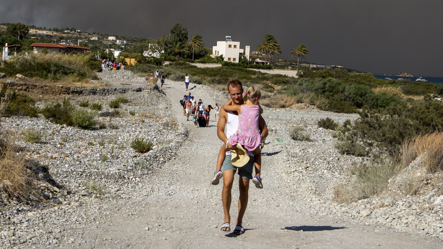 Greek authorities evacuate some 19,000 people as wildfire blazes on the Greek island of Rhodes | AP News