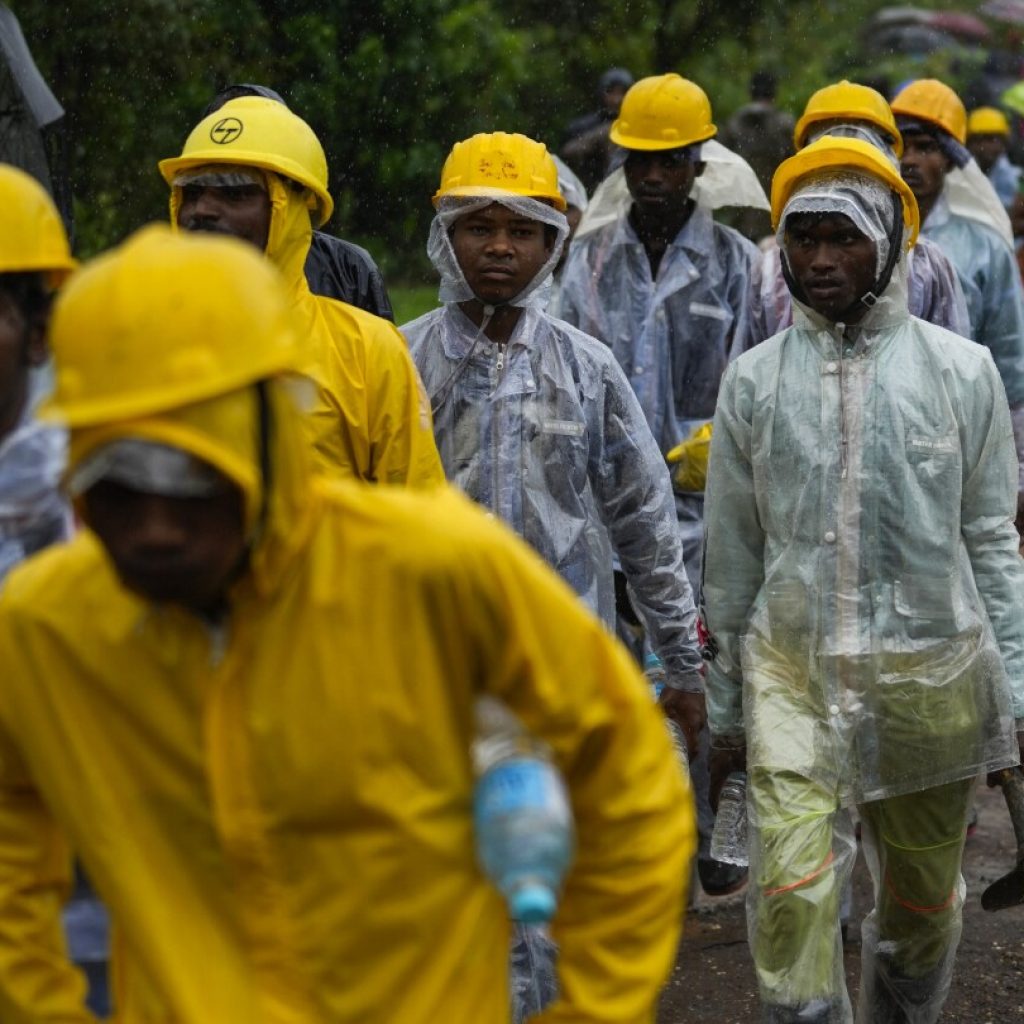 Indian rescuers recover 27 dead but no sign of dozens of missing villagers swamped by a landslide | AP News