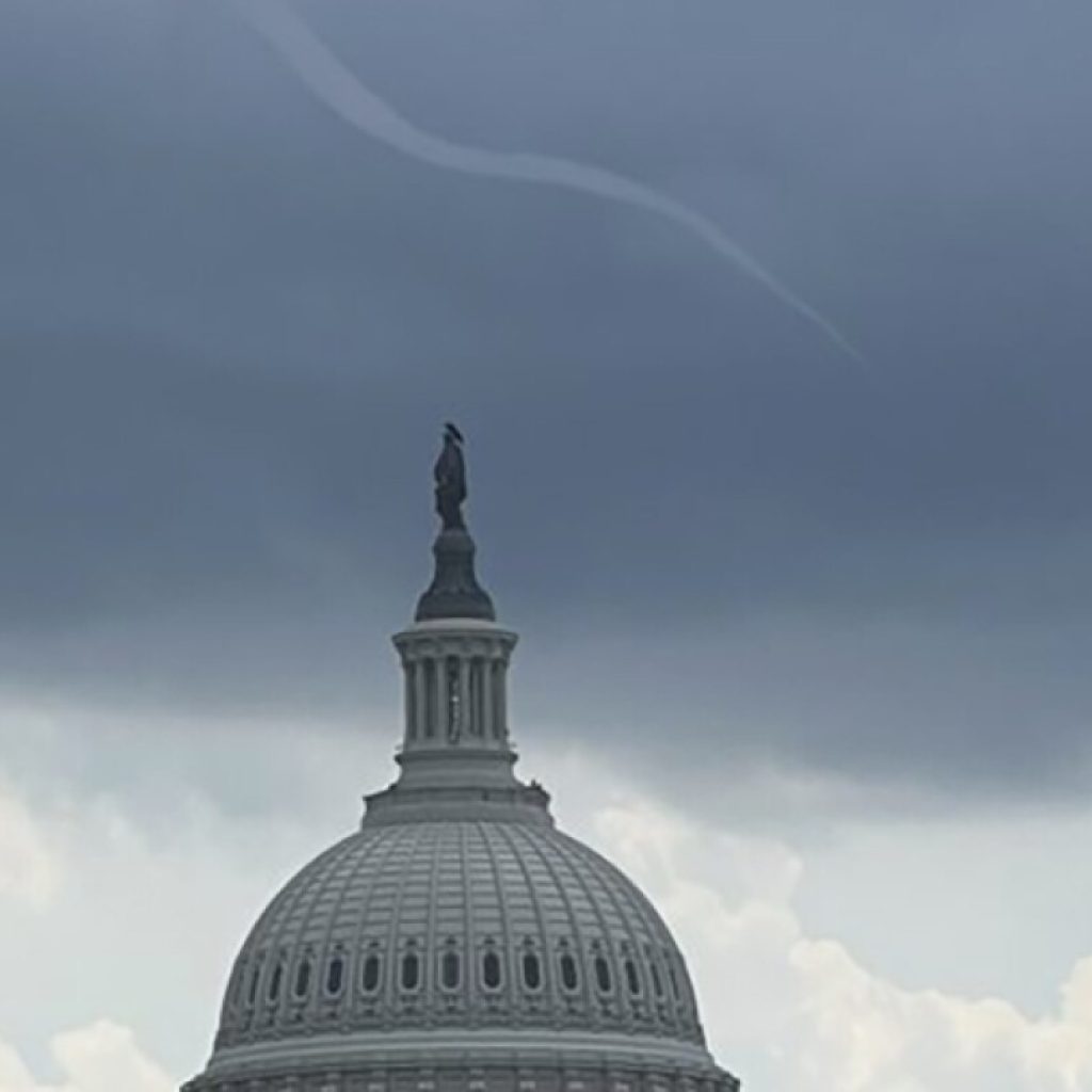 Small funnel cloud over US Capitol turns into viral photo | AP News