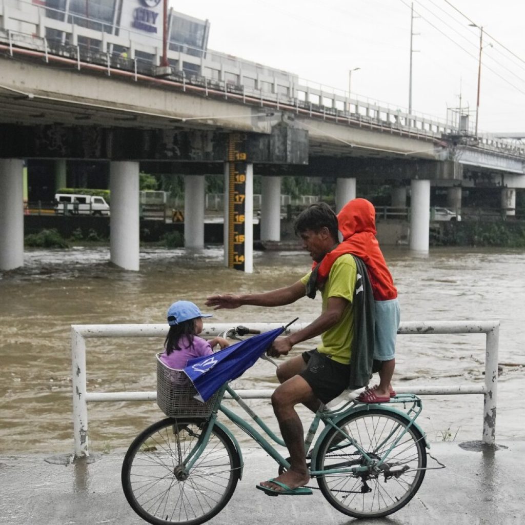 Taiwan shuts down schools and offices as Typhoon Doksuri scrapes the island’s coast | AP News