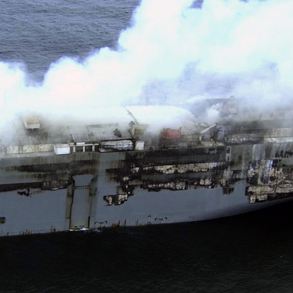 High winds stall efforts to tow a burning cargo ship packed with cars off northern Dutch coast | AP News