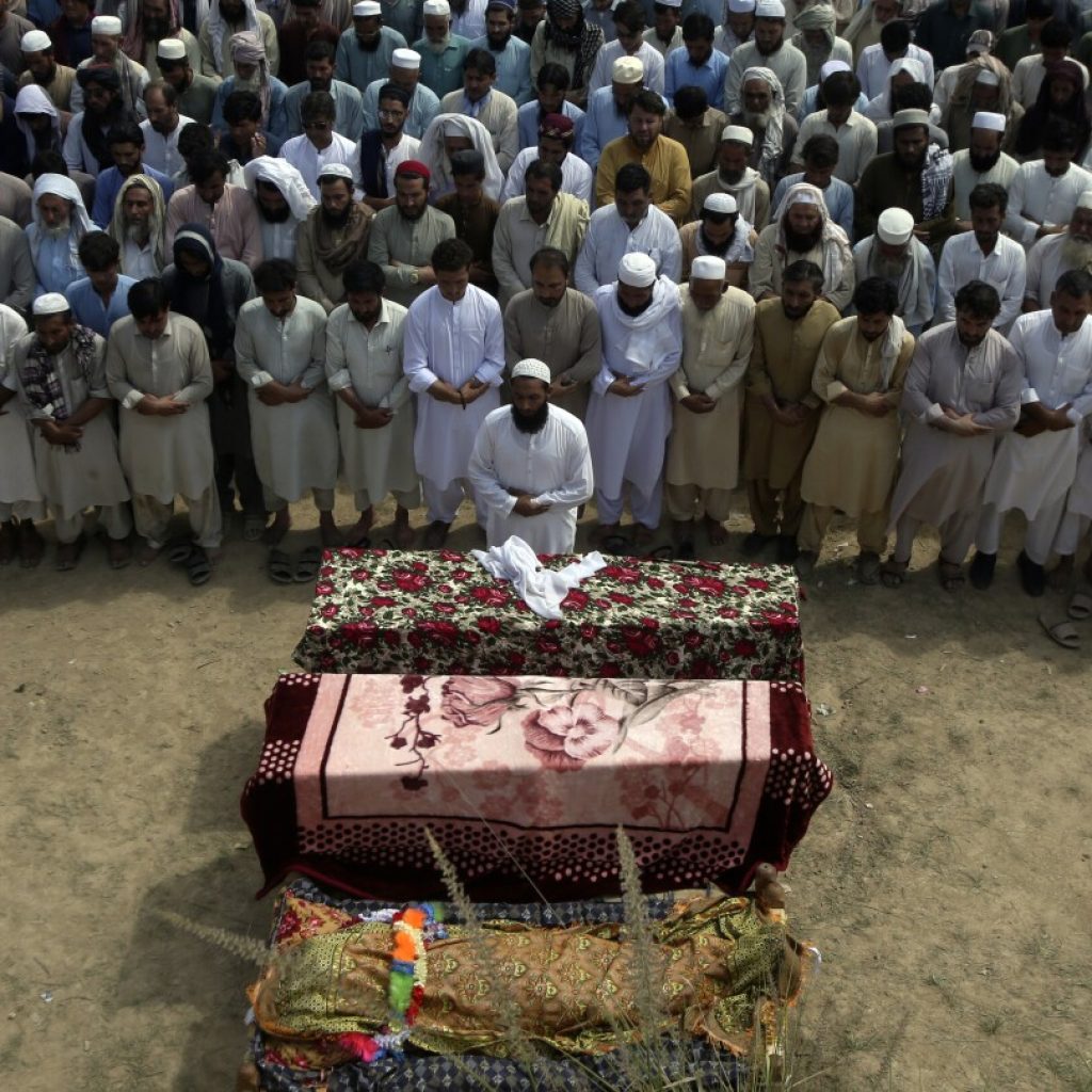 Pakistan buries dead from massive suicide attack at political rally | AP News