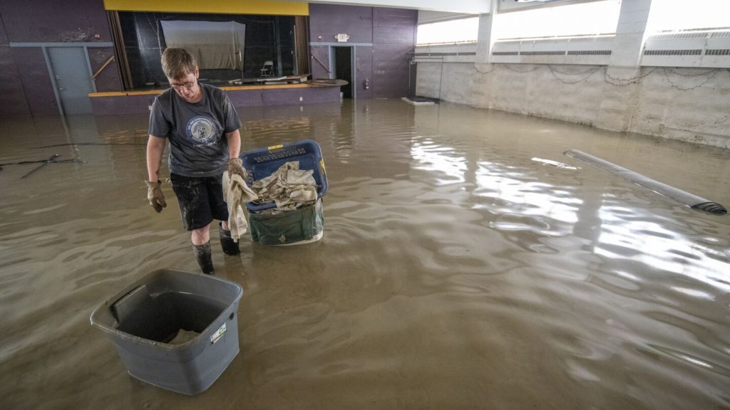 Vermont starts long road to recovery from historic floods, helped by army of volunteers | AP News