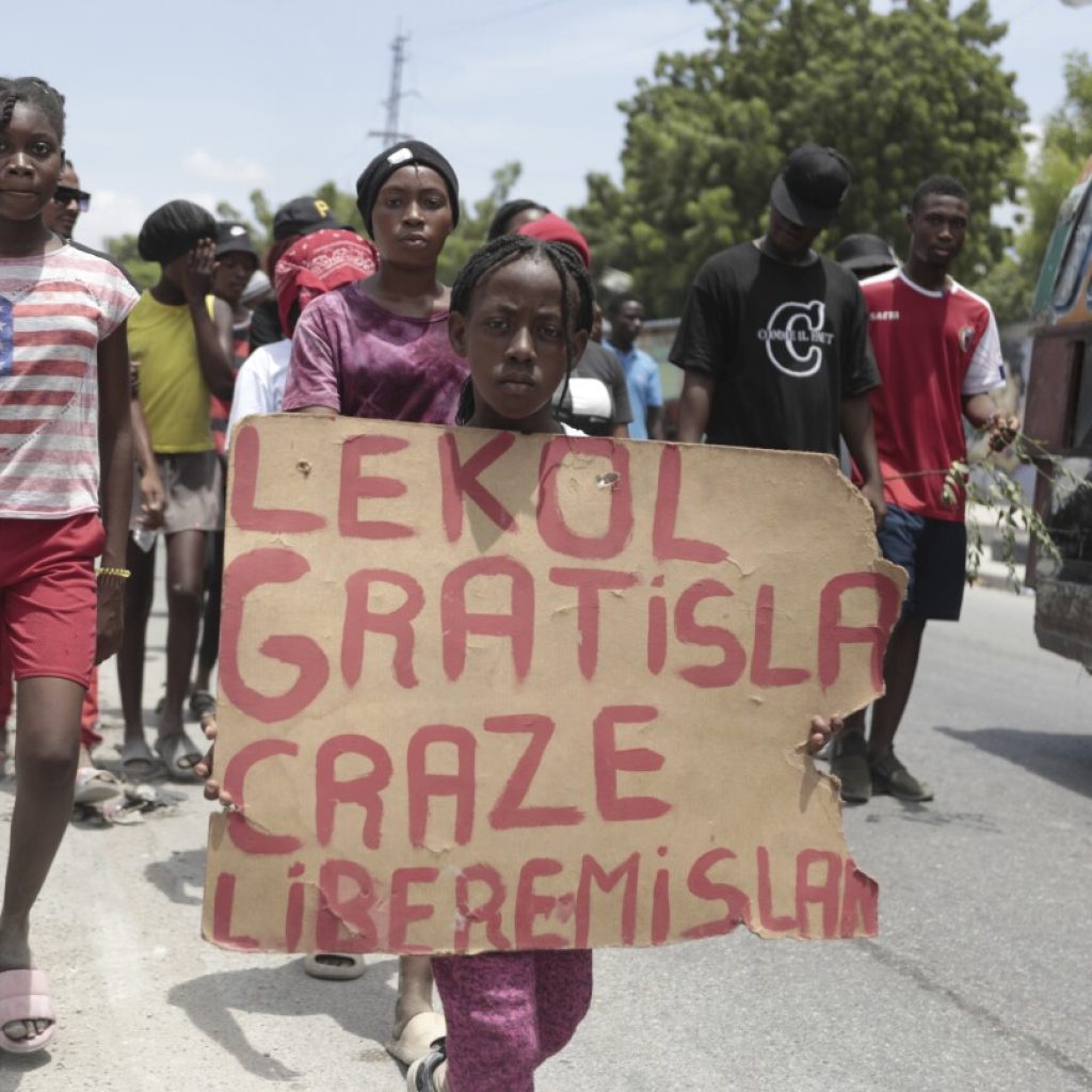 Haitians, weary of gang violence, protest the kidnapping of an American nurse and her daughter | AP News