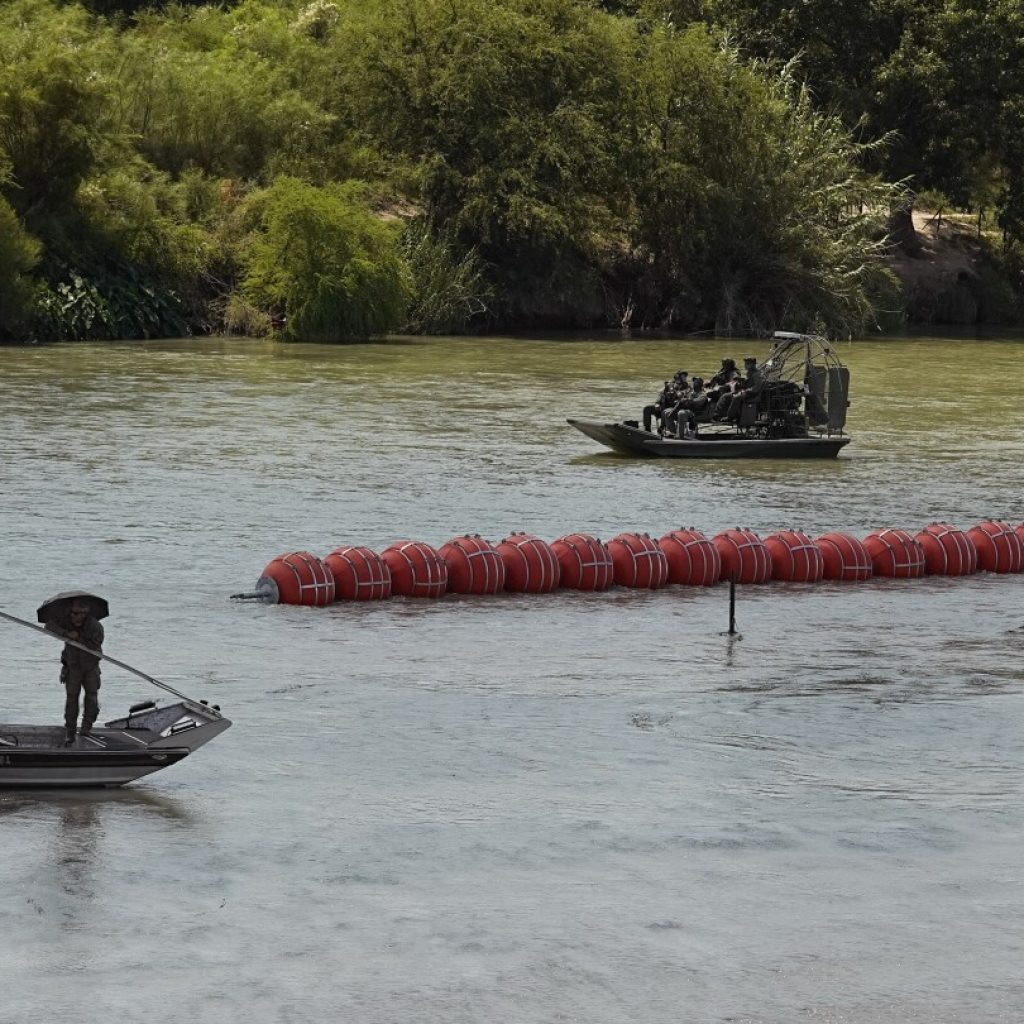 Body seen along floating barrier Texas installed in the Rio Grande, Mexico says | AP News