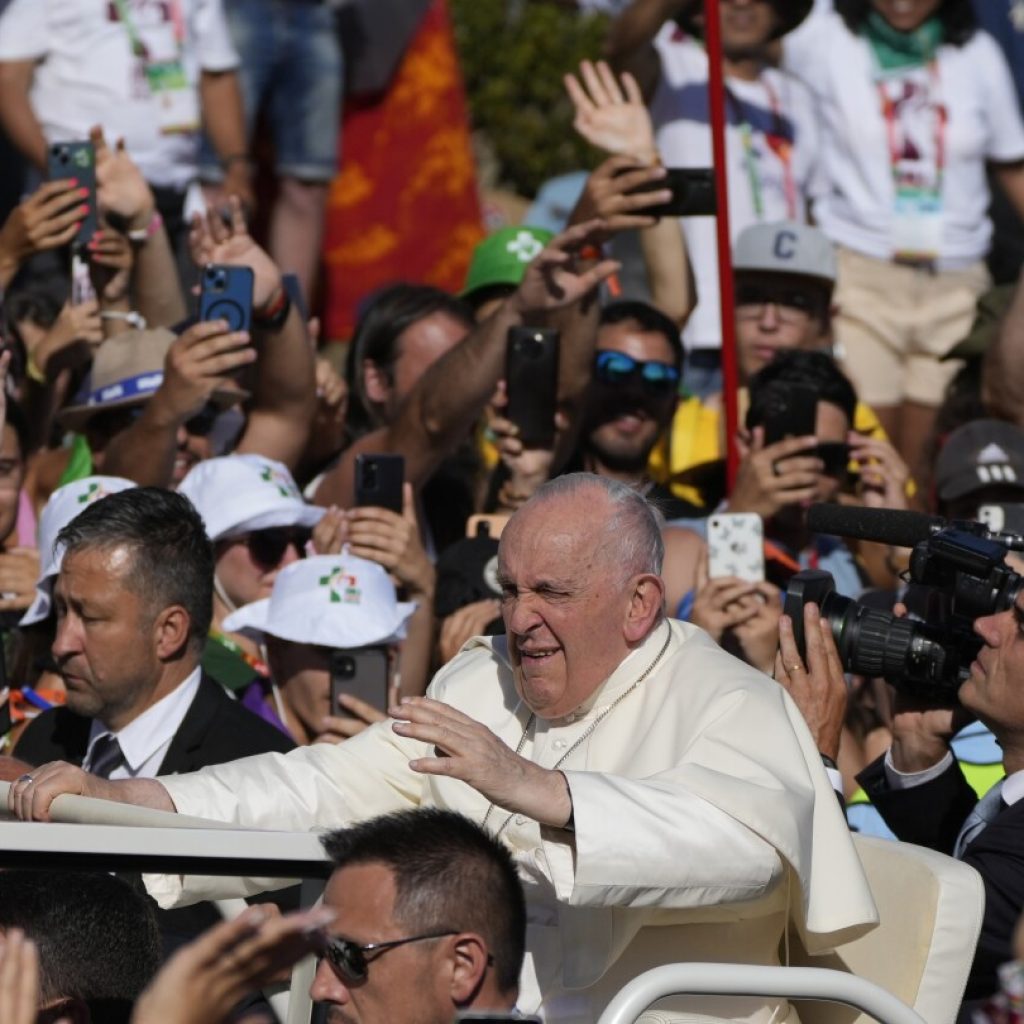 Pope presides over solemn Way of the Cross prayer as Portugal government weighs in on LGBTQ+ protest | AP News