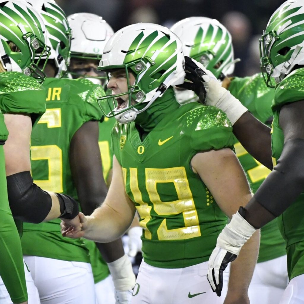 Big Ten clears way for Oregon, Washington to join, AP sources say, putting Pac-12 on brink | AP News