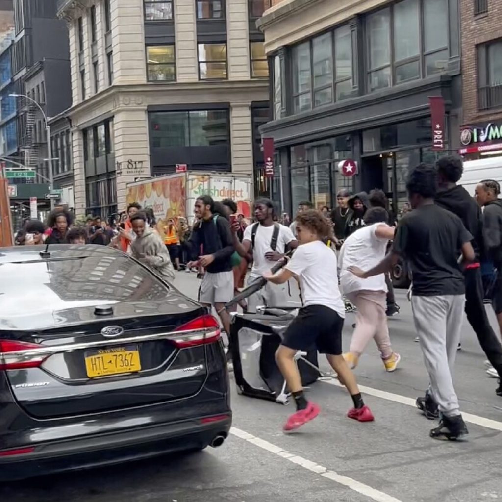 Crowd overwhelms New York City’s Union Square, tosses chairs, climbs on vehicles | AP News