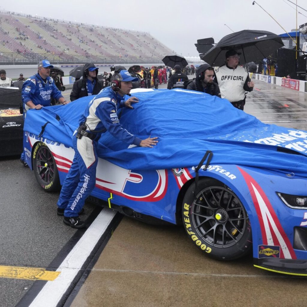 NASCAR suspends race at Michigan due to rain and aims to resume Monday | AP News