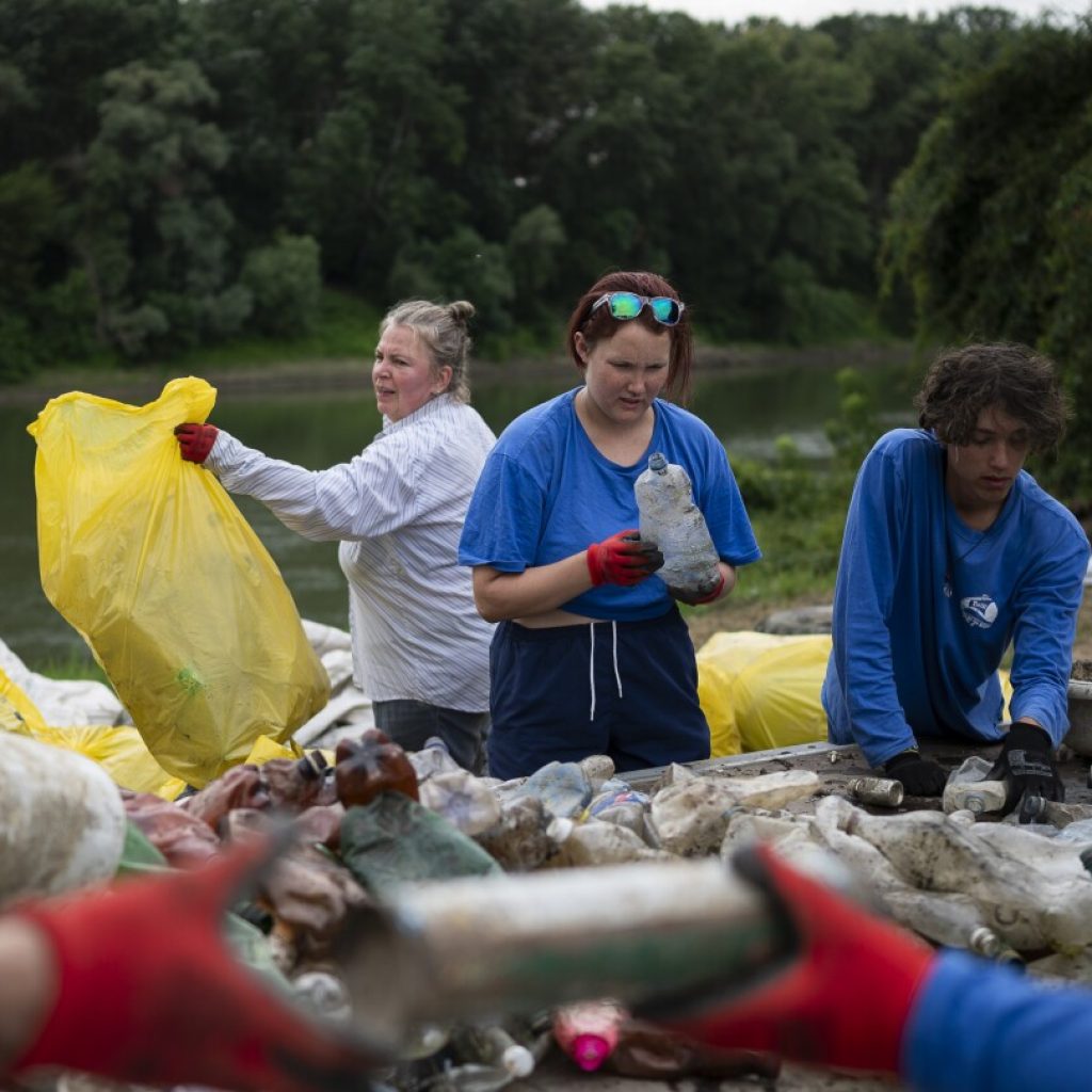 Volunteers head off plastic waste crisis by removing tons of rubbish from Hungarian river | AP News