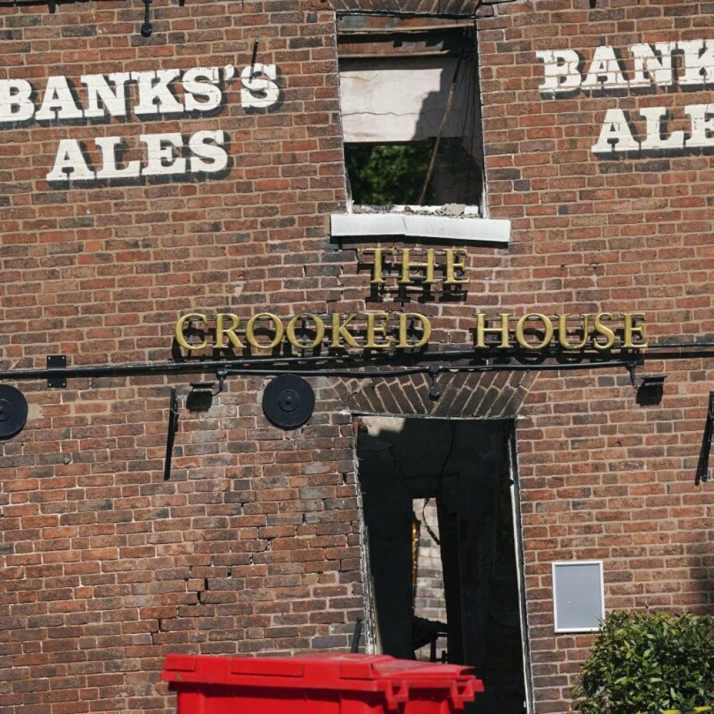 Angry villagers in England call for the quirky Crooked House pub to be rebuilt following demolition | AP News