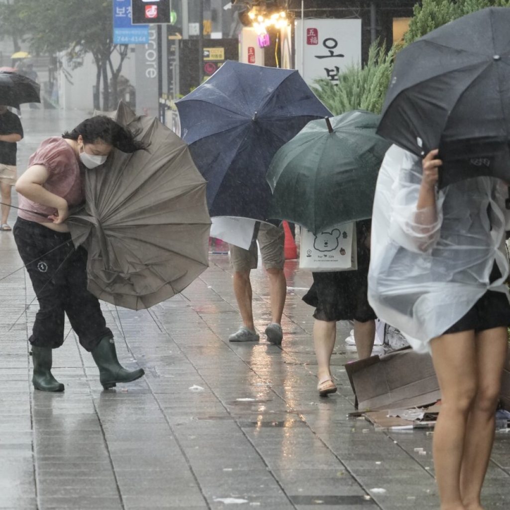 Khanun blows strong winds and heavy rains into South Korea, where thousands evacuated the coast | AP News