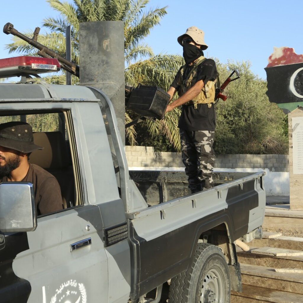 Libya deploys security forces across Tripoli after clashes between rival militias left 27 dead | AP News