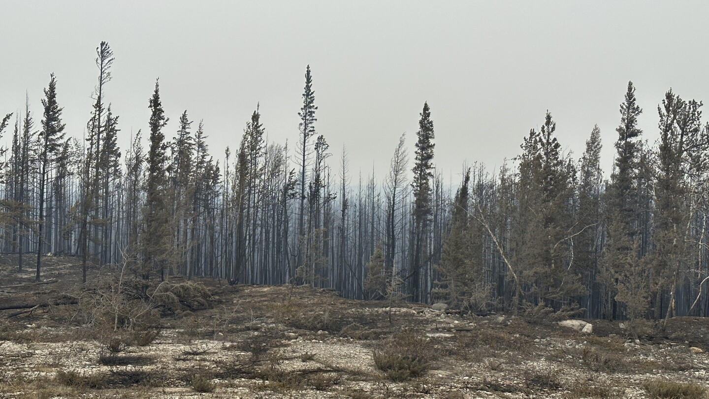 Residents flee capital of Canada’s Northwest Territories ahead of Friday deadline as wildfire nears | AP News