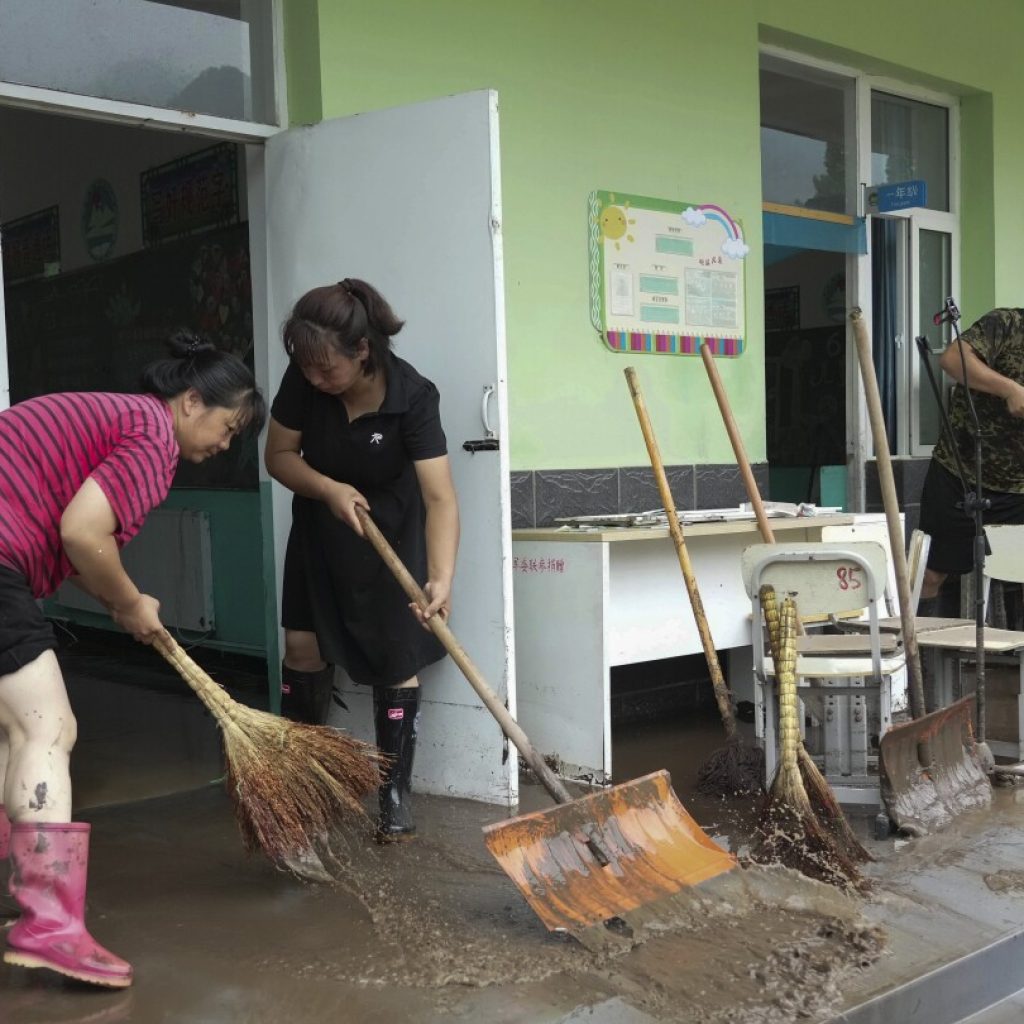 China’s Xi calls for measures to mitigate disastrous flooding amid economic slowdown | AP News