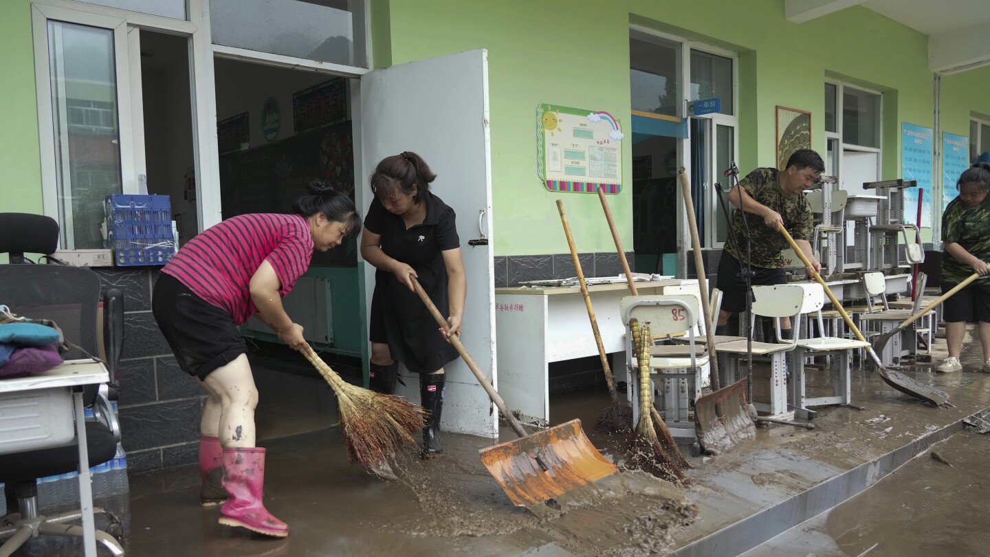 China’s Xi calls for measures to mitigate disastrous flooding amid economic slowdown | AP News