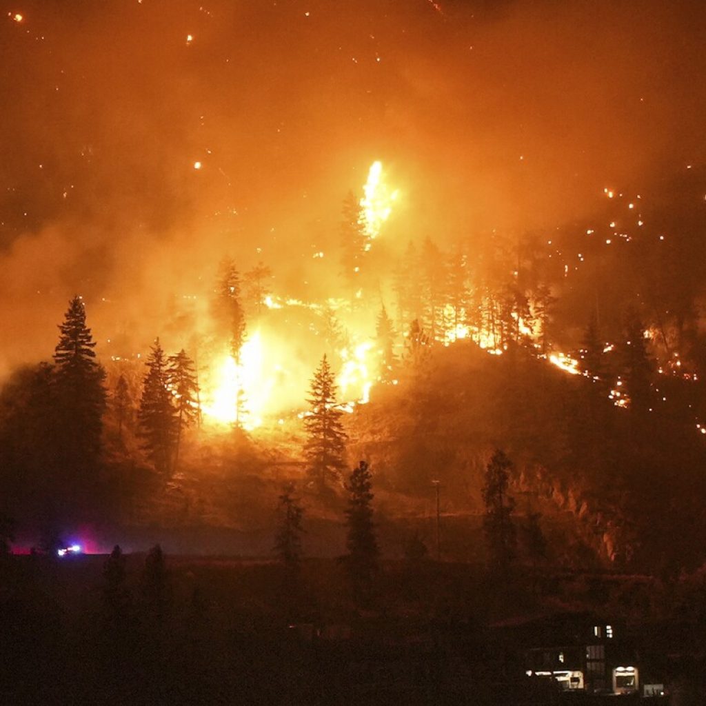 Thousands flee raging wildfire, turning capital of Canada’s Northwest Territories into ghost town | AP News