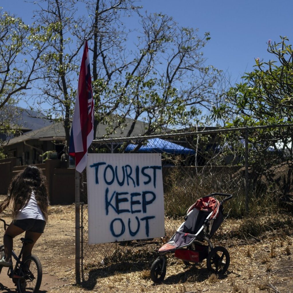 As Maui rebuilds, residents reckon with tourism’s role in their recovery | AP News