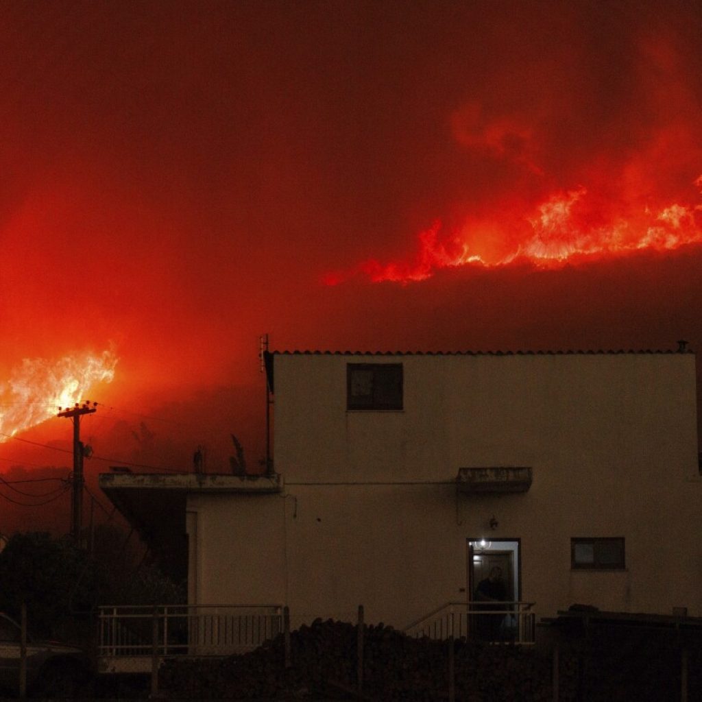 Bodies of 18 people found in area struck by wildfires in Greece | AP News