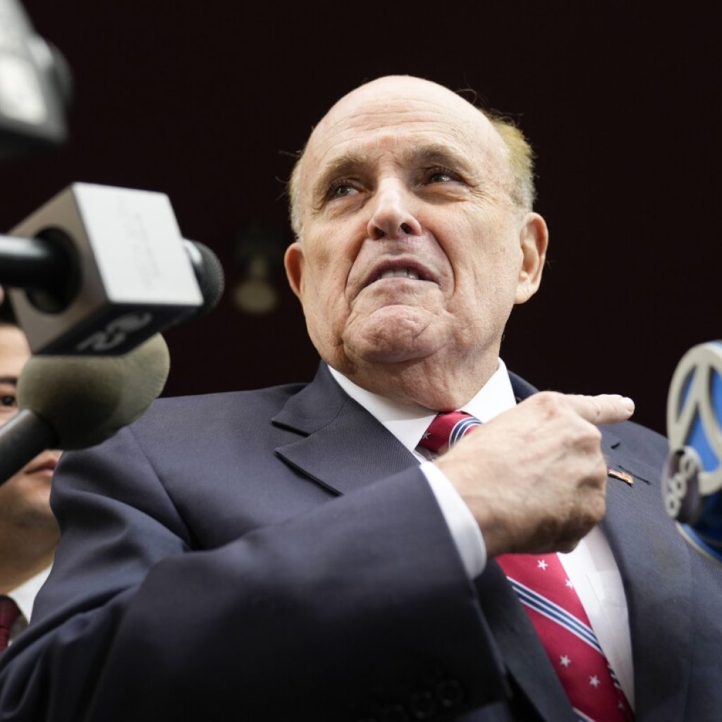 Giuliani turns himself in on Georgia 2020 election charges after bond is set at $150,000 | AP News