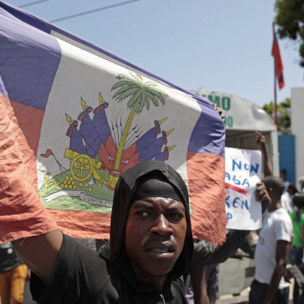 A gang in Haiti opens fire on a crowd of parishioners trying to rid the community of criminals | AP News