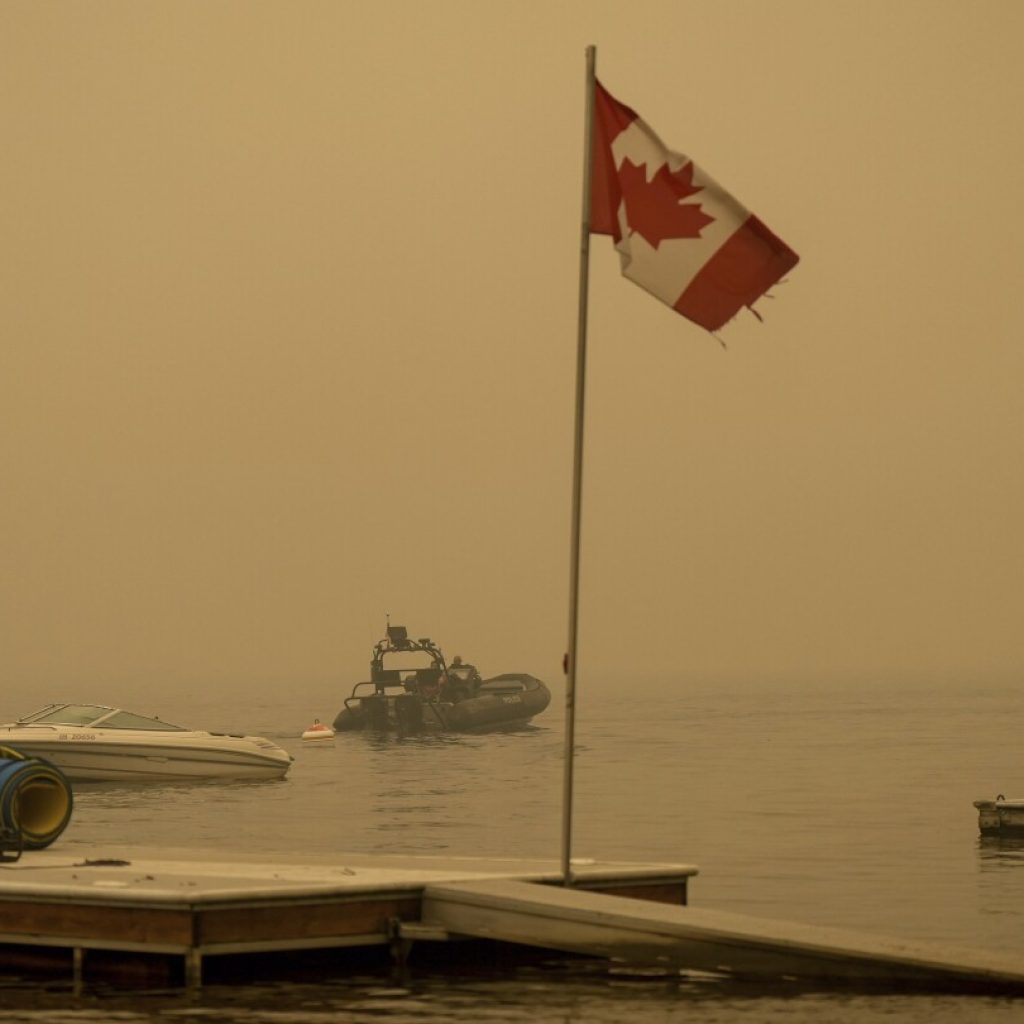 Some wildfire evacuations end in British Columbia, but fire threatens community farther north | AP News