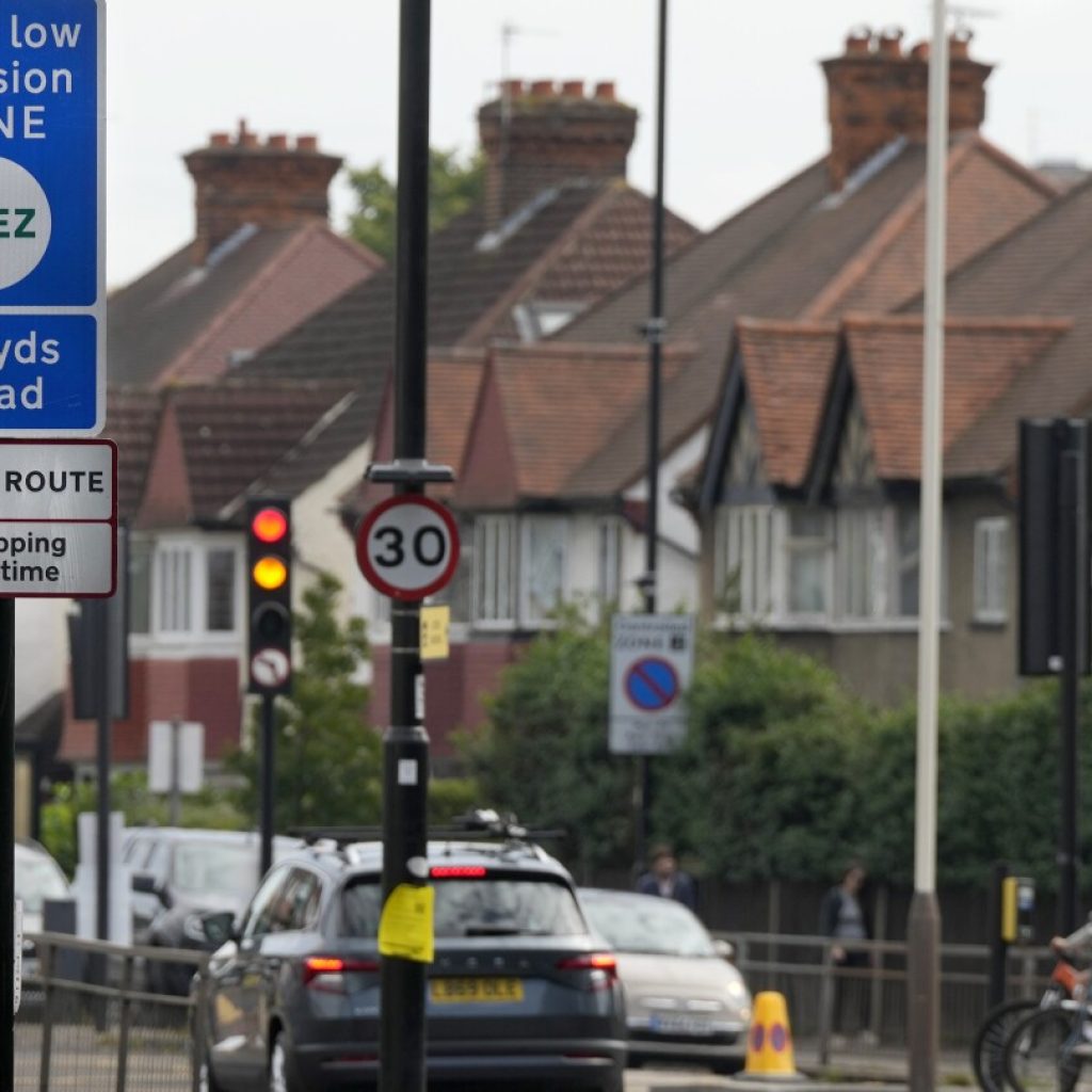 London’s plan to charge drivers of polluting cars sparks protests and stirs political passions | AP News