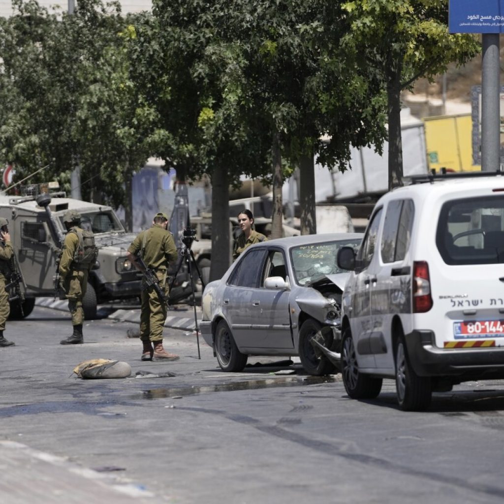 Palestinians clash with own security forces in a West Bank refugee camp, leaving 1 dead | AP News