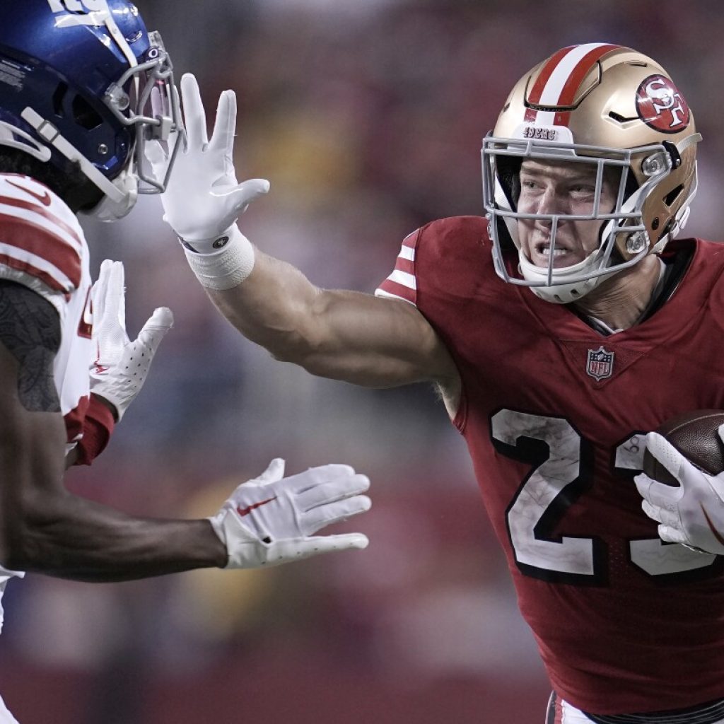 Christian McCaffrey and the 49ers win 13th straight in the regular season, beat the Giants 30-12 | AP News