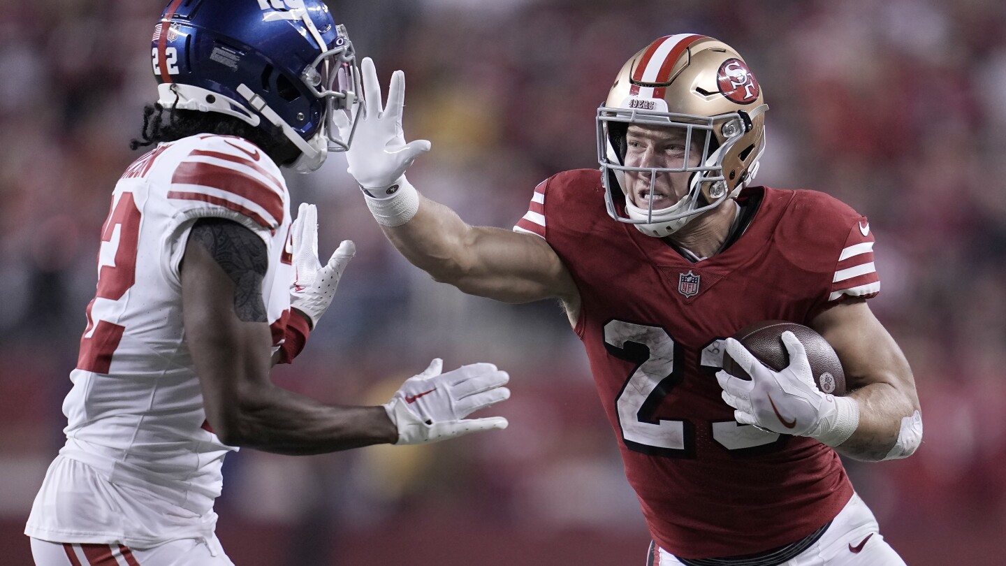 Christian McCaffrey and the 49ers win 13th straight in the regular season, beat the Giants 30-12 | AP News