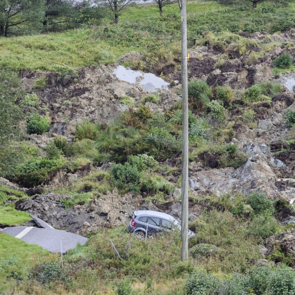 A landslide in Sweden causes a huge sinkhole on a highway and 3 are injured when cars crash | AP News