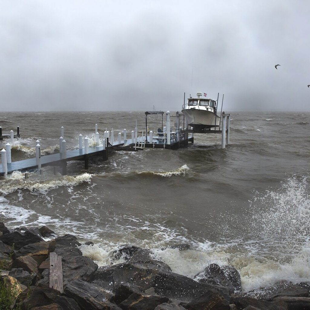 Mid-Atlantic coast under flood warnings as Ophelia weakens to post-tropical low and moves north | AP News