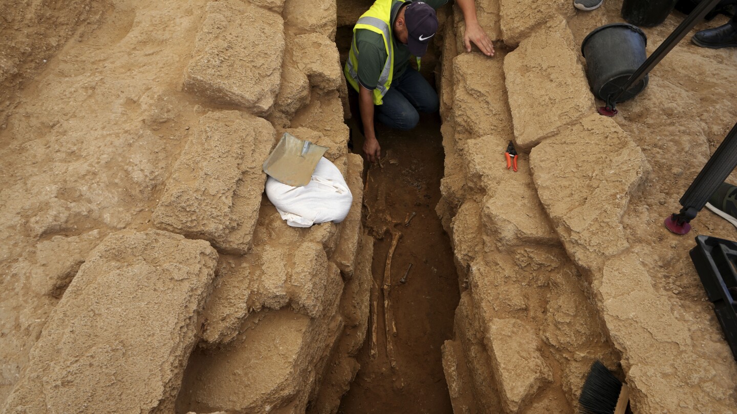 Archaeologists unearth the largest cemetery ever discovered in Gaza and find rare lead sarcophogi | AP News