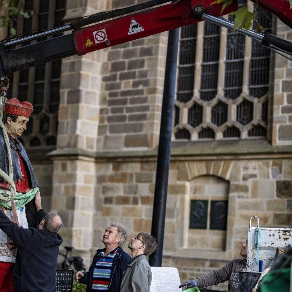 A statue of a late cardinal accused of sexual abuse has been removed from outside a German cathedral | AP News