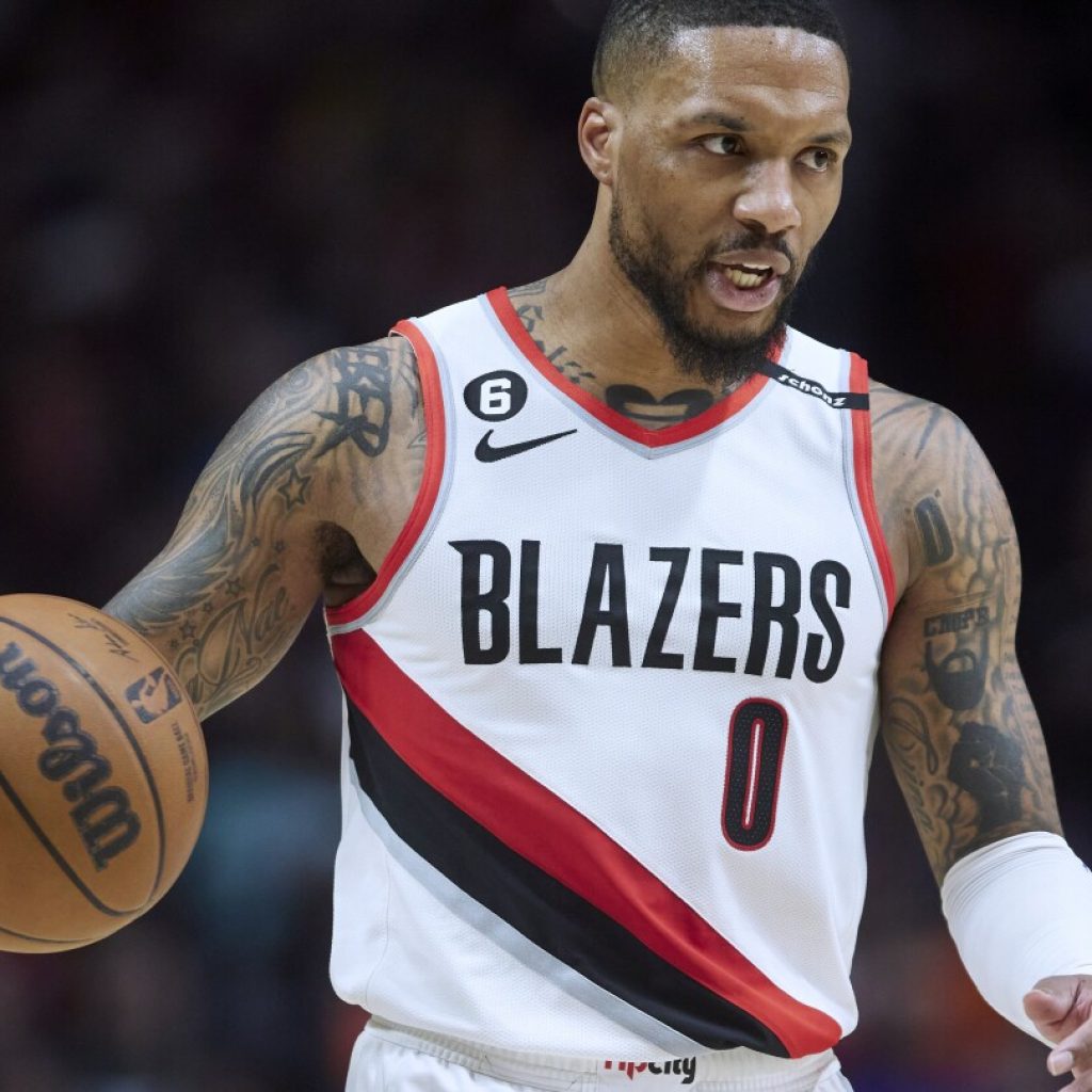 Damian Lillard is being traded from the Trail Blazers to the Bucks, AP source says, ending long saga | AP News