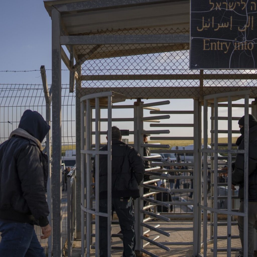 Israel reopens the main Gaza crossing for Palestinian laborers and tensions ease | AP News