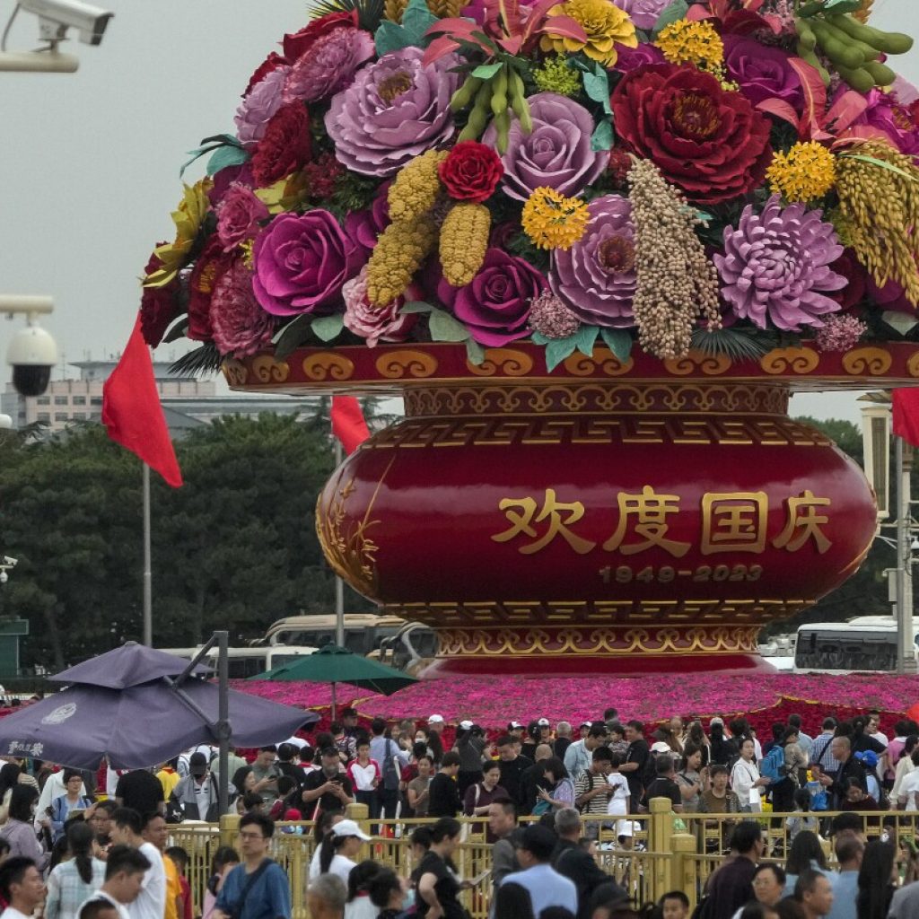 Millions take to China’s railways, roads, air in 1st big autumn holiday since end of zero-COVID | AP News