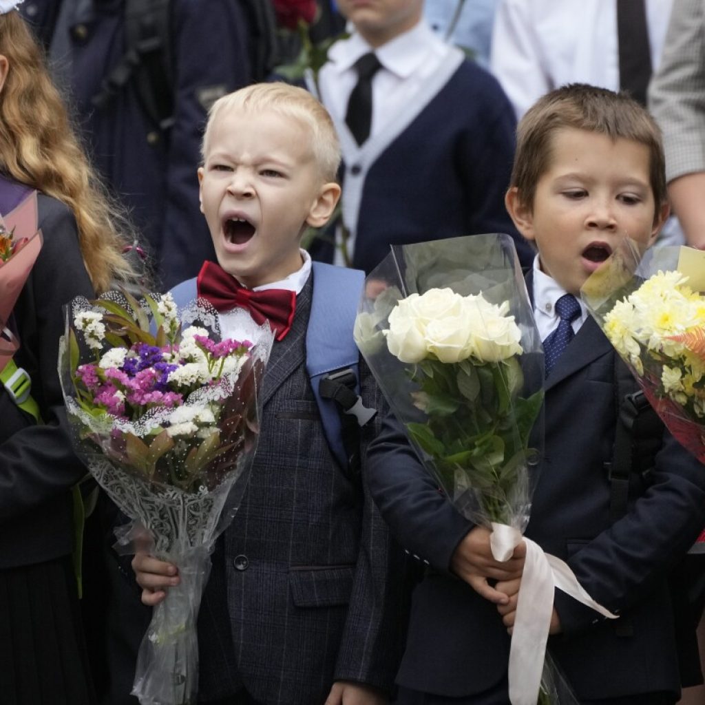 Russian students are returning to school, where they face new lessons to boost their patriotism | AP News