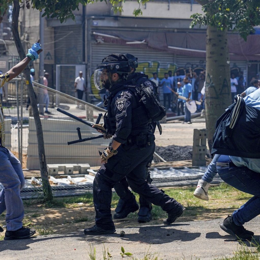 Dozens injured in a protest by asylum-seekers outside Eritrean Embassy in Israel | AP News