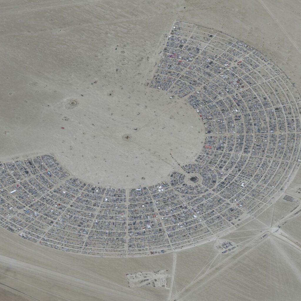 Tens of thousands still stranded by Burning Man flooding in Nevada desert | AP News