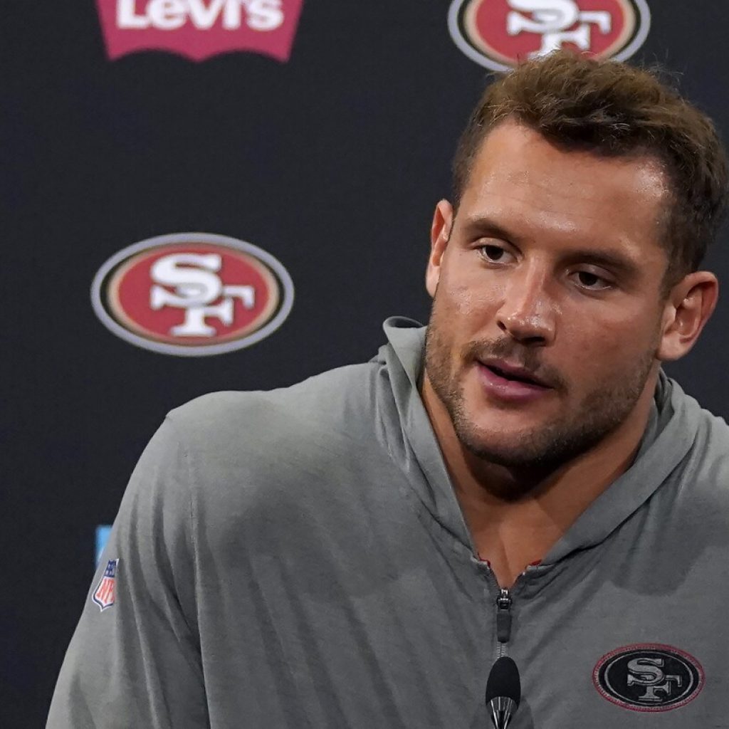 49ers sign Nick Bosa to a record-setting contract extension to end his lengthy holdout | AP News