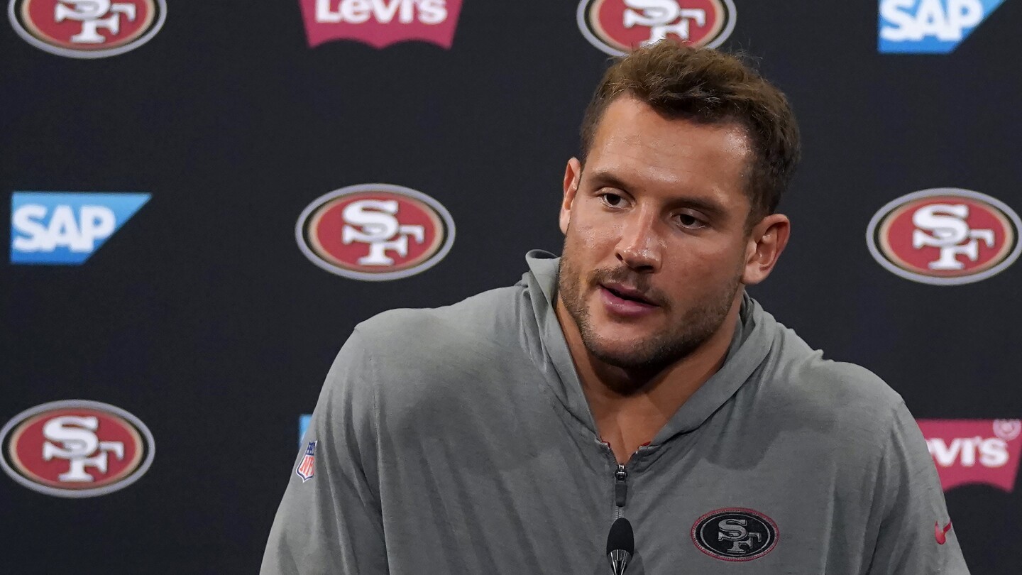 49ers sign Nick Bosa to a record-setting contract extension to end his lengthy holdout | AP News