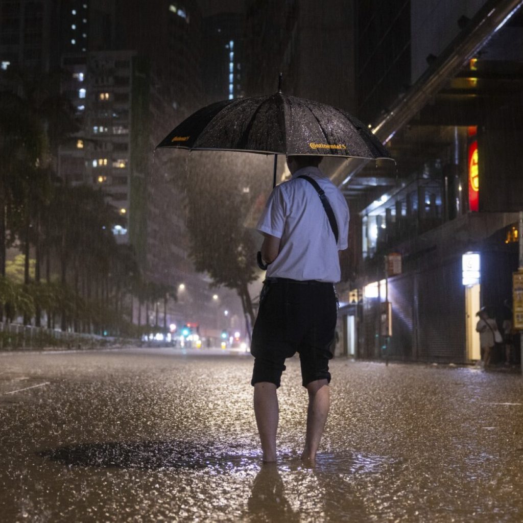 Rain pouring onto Hong Kong and southern China floods city streets and subway stations | AP News