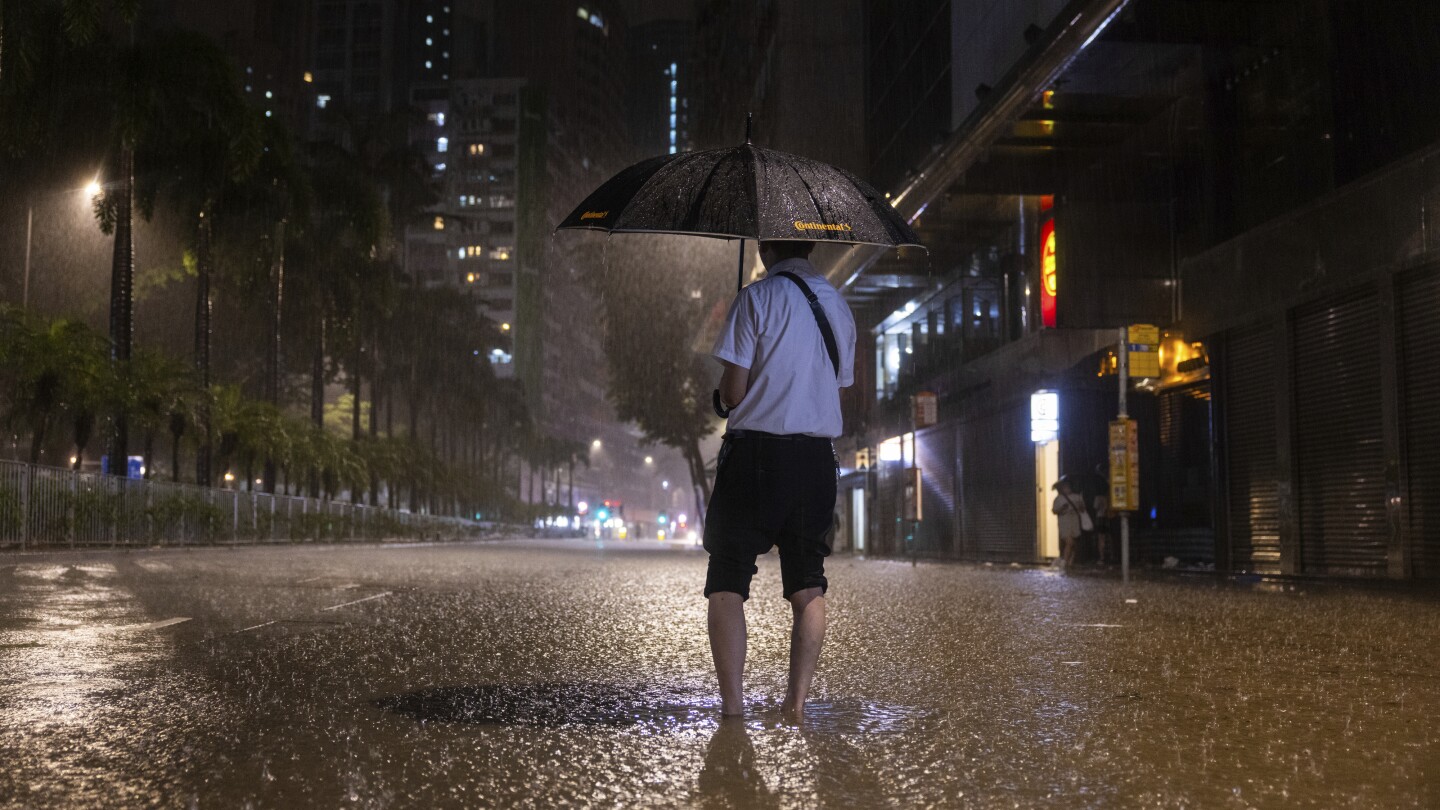 Rain pouring onto Hong Kong and southern China floods city streets and subway stations | AP News