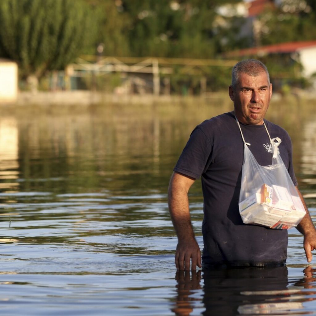 Greek authorities evacuate another village as they try to prevent flooding in a major city | AP News