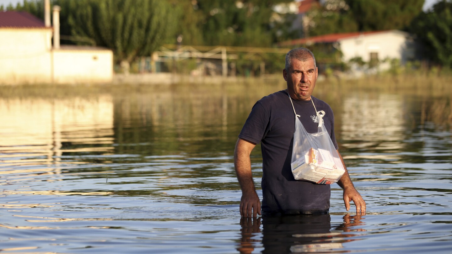 Greek authorities evacuate another village as they try to prevent flooding in a major city | AP News